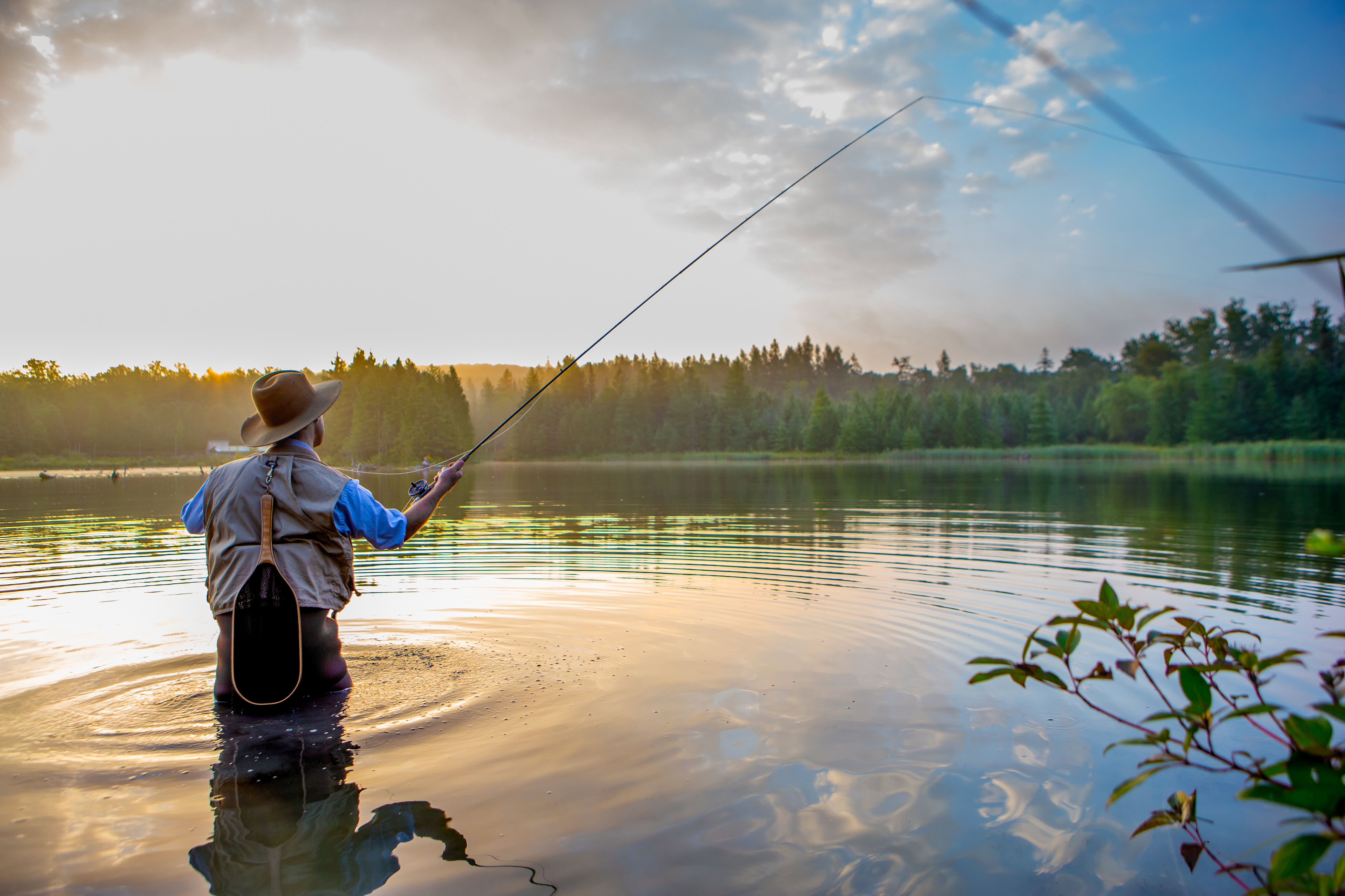 Picture a man fishing in a lake